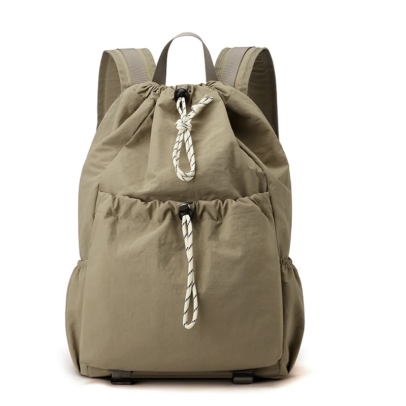 Khaki drawstring backpack on a plain background.