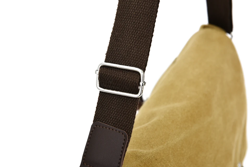 Close-up of a shoulder strap and metal adjuster.